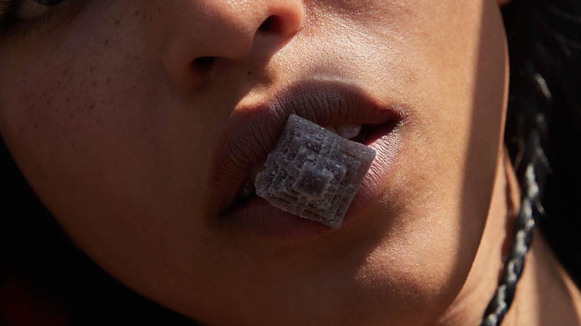 woman eating a gomita